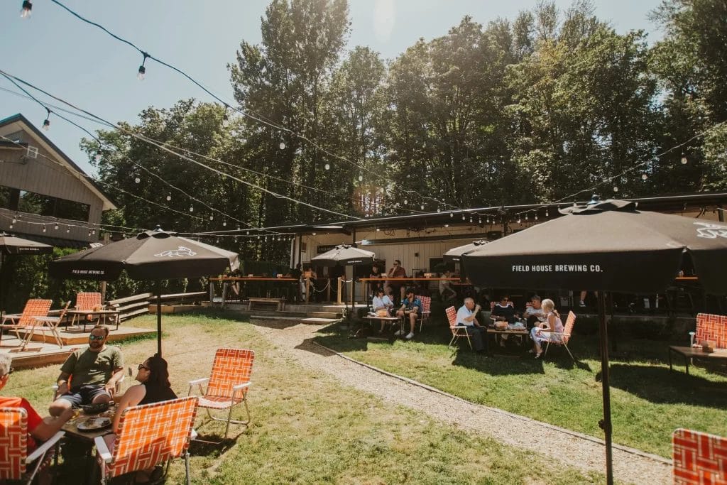 the sunny beer lawn and patio spaces at Field House Brewing ABBY in Abbotsford, BC