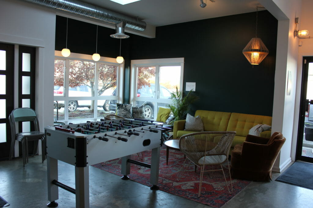 image of cozy couch corner and Foosball table at Land & Sea Brewing Co.