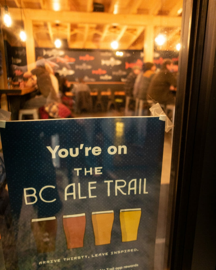 image of "You're on the BC ale Trail" poster on the door at Smithers Brewing Company