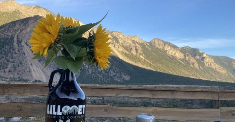 a growler with sunflowers and scenic vistas at Lillooet Brewing Company in Lillooet, BC