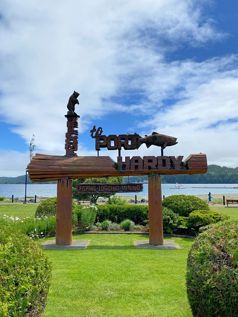 a carved welcome sign at an oceanside park in Port Hardy, BC