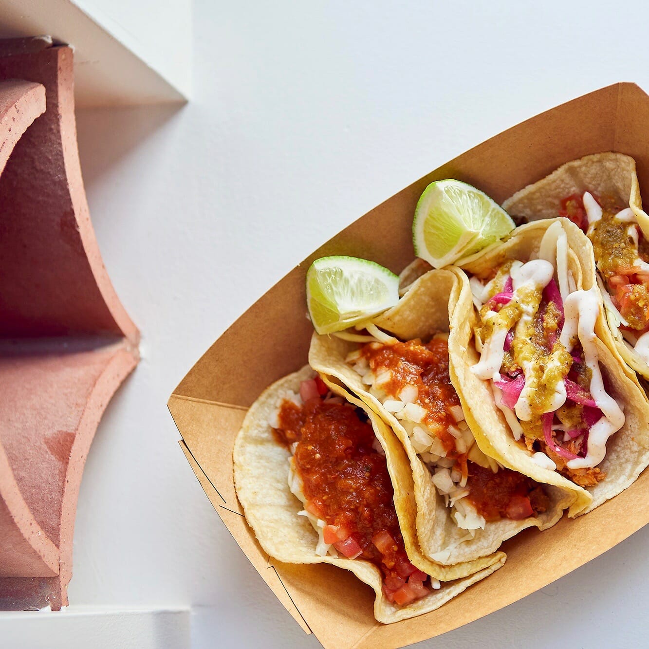 a box filled with loaded tacos at La Cerveceria Astilleros in North Vancouver, BC