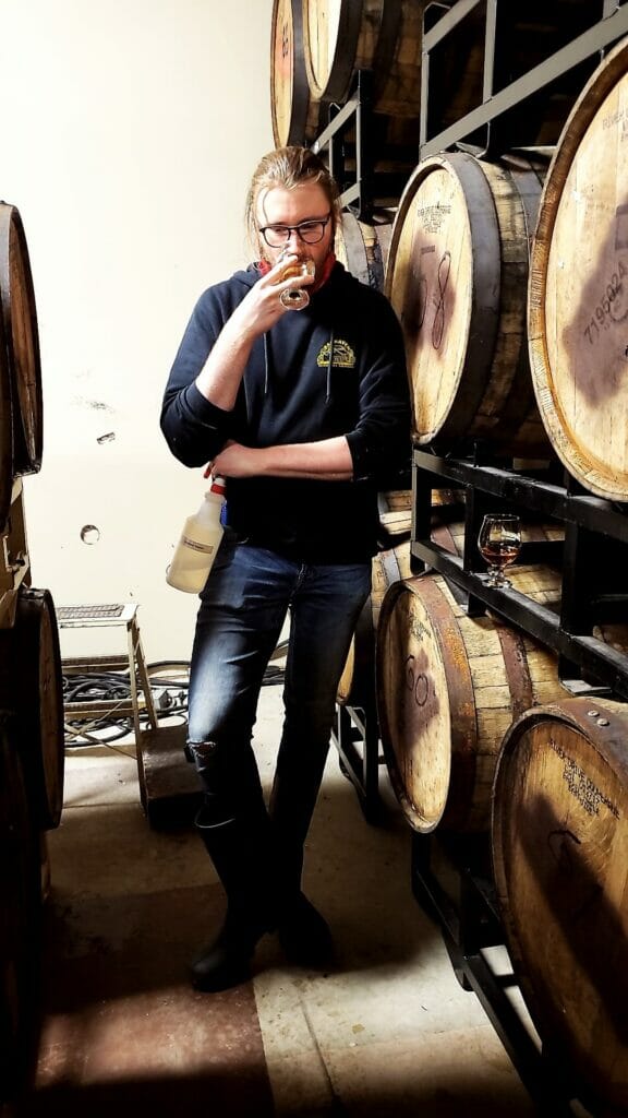Justin Larter doing some sensory testing on a beer in the barrel room at Barnside Brewing, South of the Fraser Ale Trail