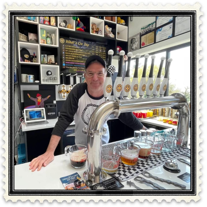 David Aiken poses behind the taps at Checkerhead Brewing in Shirley, BC