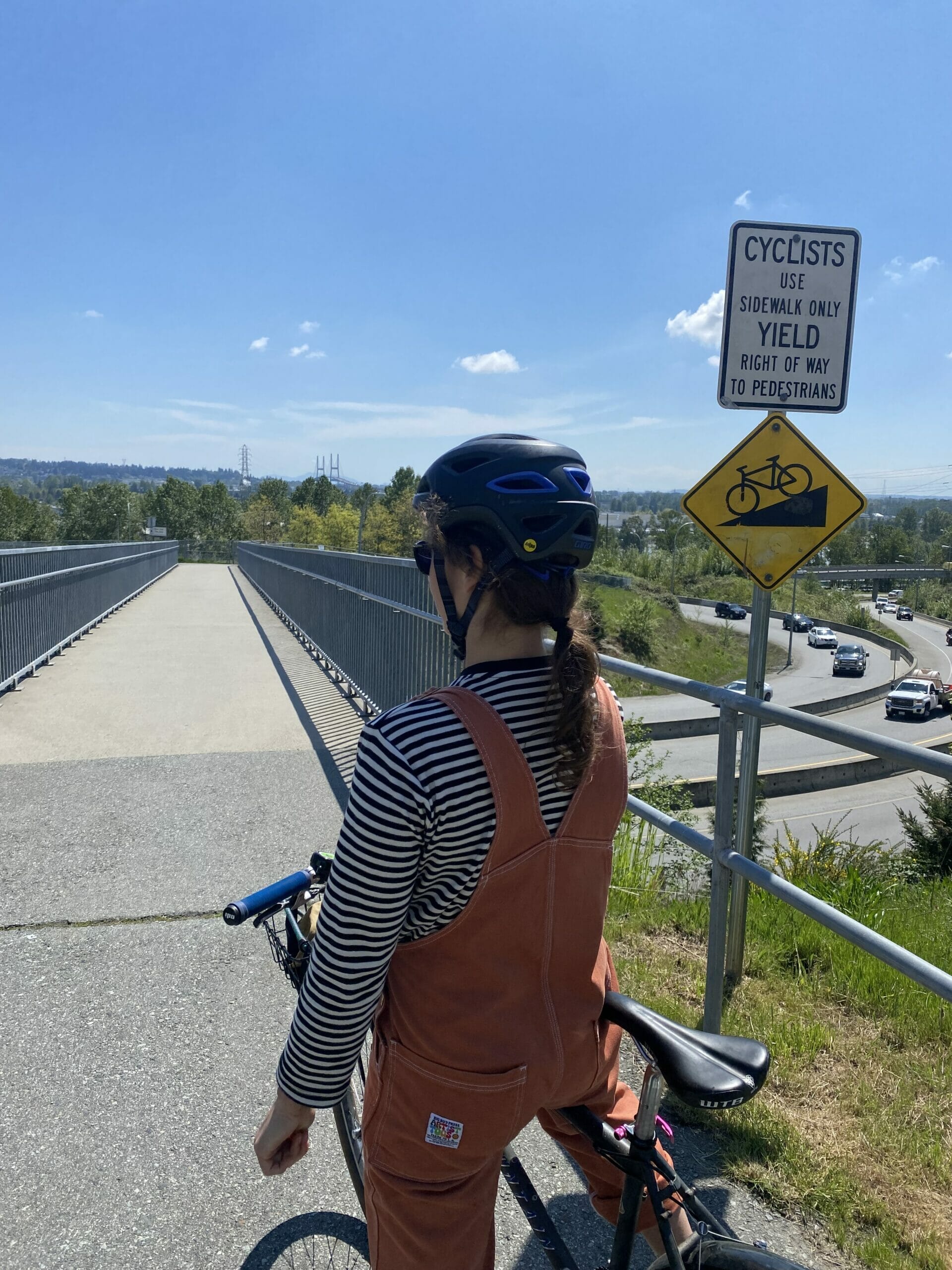 A cyclist preparing to cross the Stewardson Way overpass