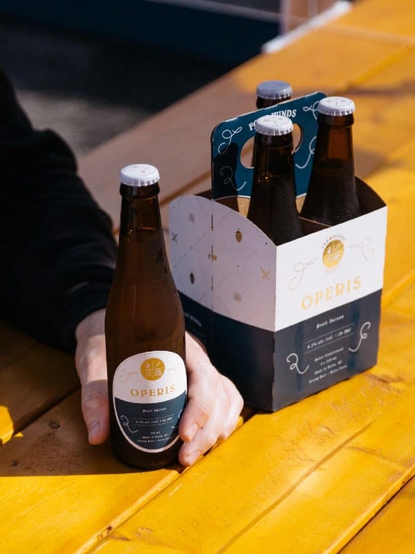 A six-pack of bottles of Operis beer from Four Winds Brewing in Delta, BC