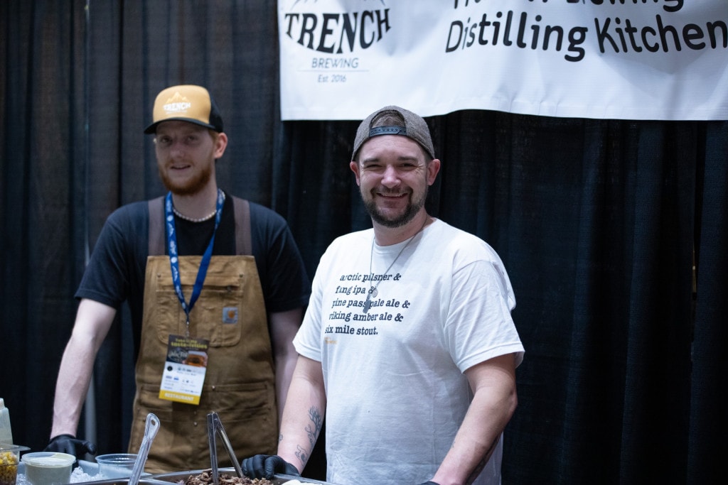 Representatives of Trench Brewing at their booth at the Kiwanis AleFest - Ivan Eytzen