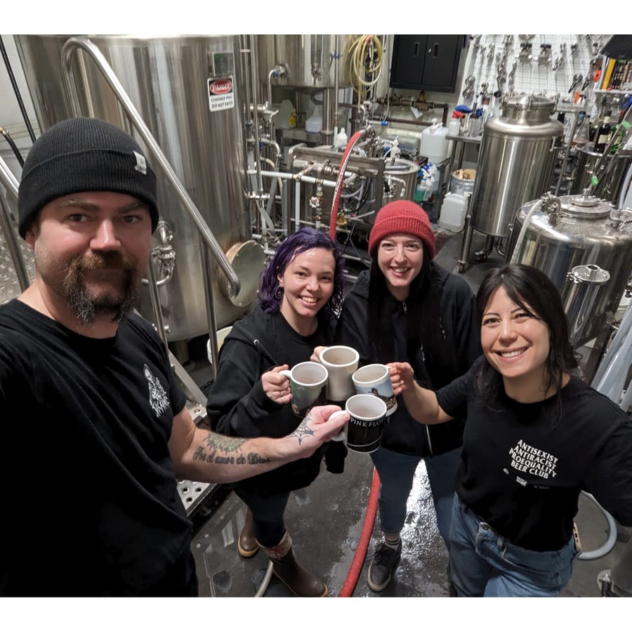 a photo of Brad Tomlinson from Jackknife BRewing in Kelowna with women from the brewery in the back of house