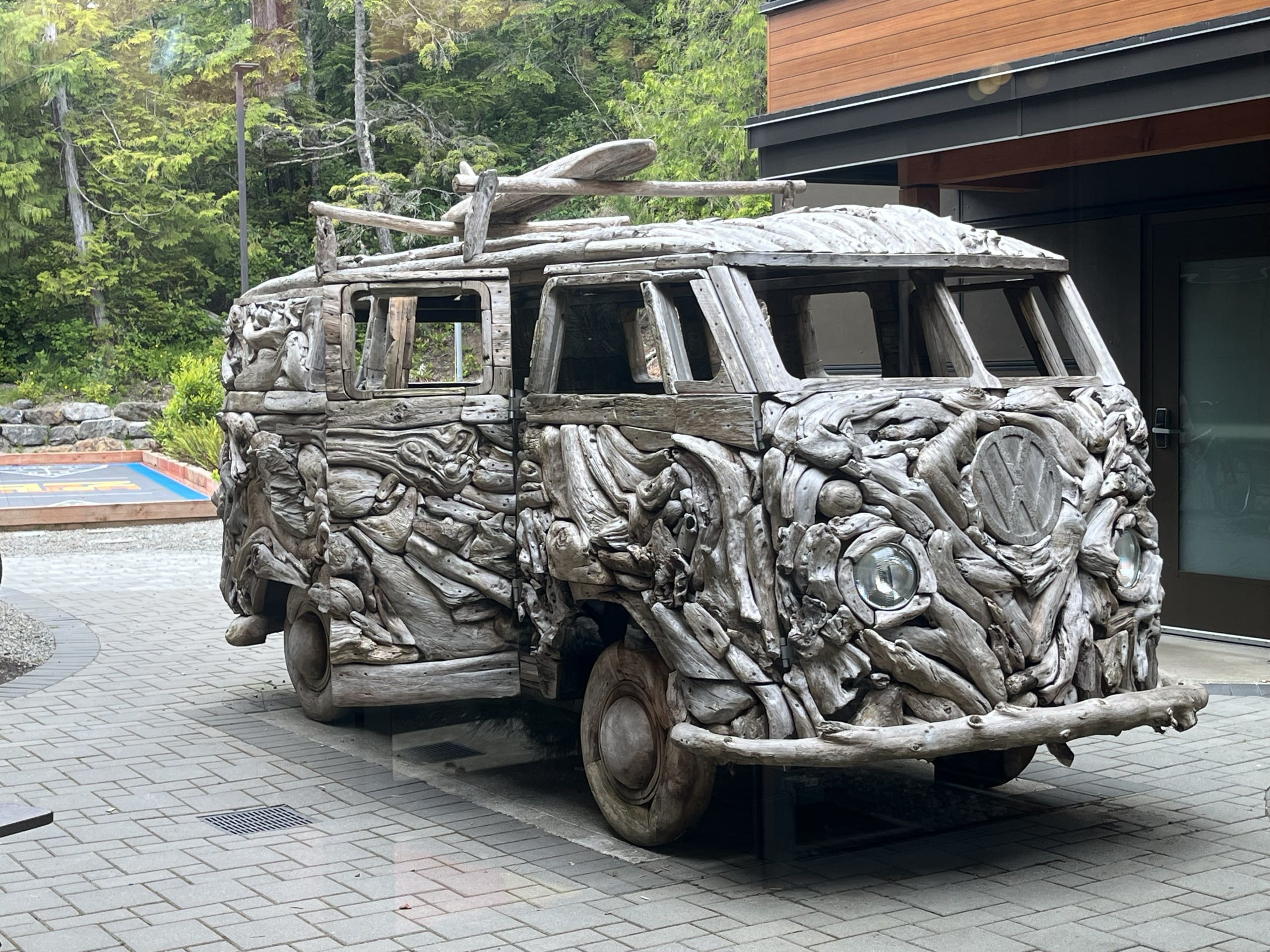 a driftwood covered VW van at Hotel Zed in Tofino, BC