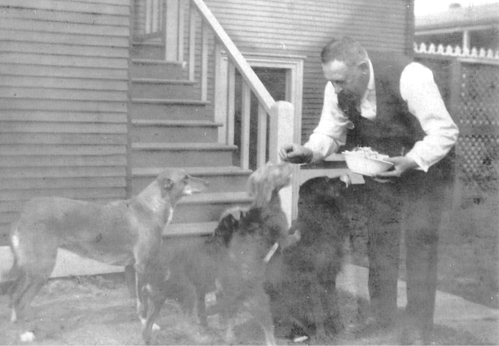 Doering and his dogs outside his house on the brewery lot