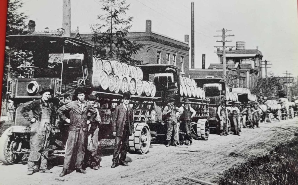 Vancouver Breweries trucks laden with wooden kegs of beer