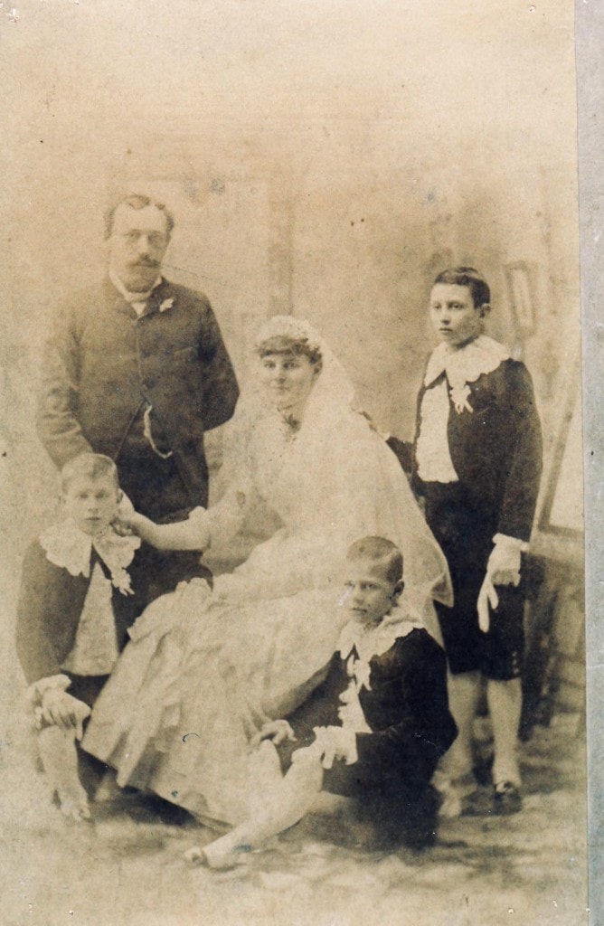 a wedding portrait of Charles Doering and Sarah Jane Helgesen, with three young boys in attendance