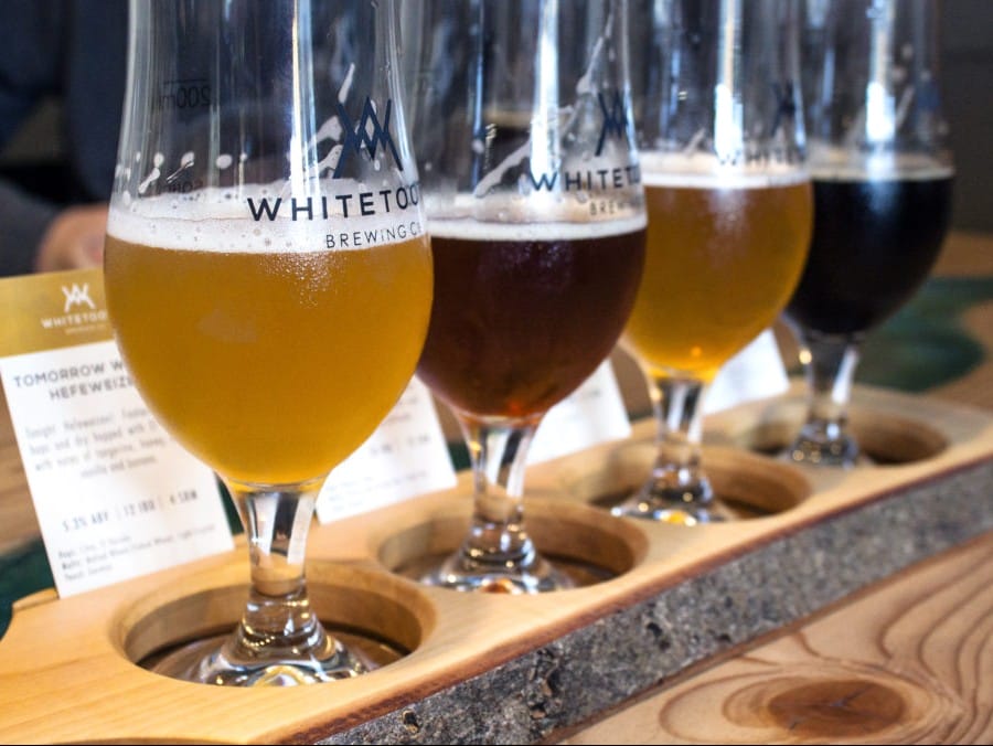 a flight of craft beers at Whitetooth Brewing in Golden, BC