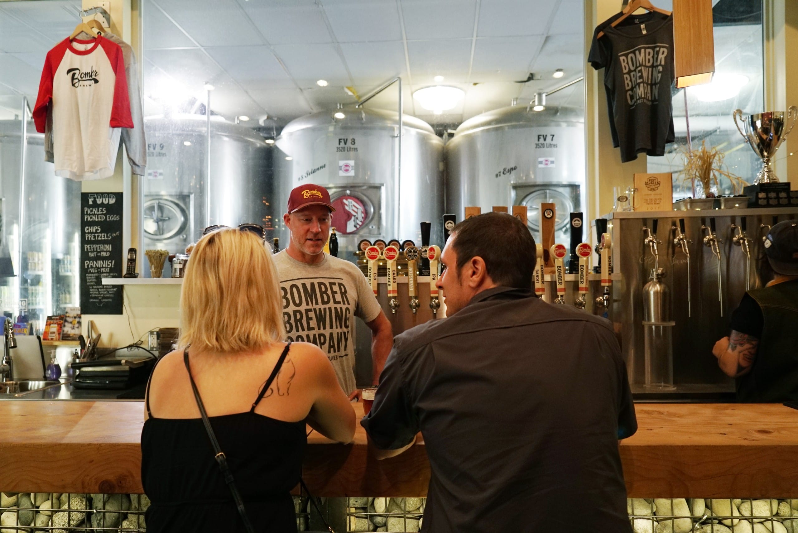 founder Don Farion behind the bar at Bomber Brewing in Vancouver, BC