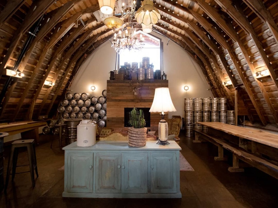 The loft at Barn Owl Brewing in Kelowna, BC, decorated with vintage furniture