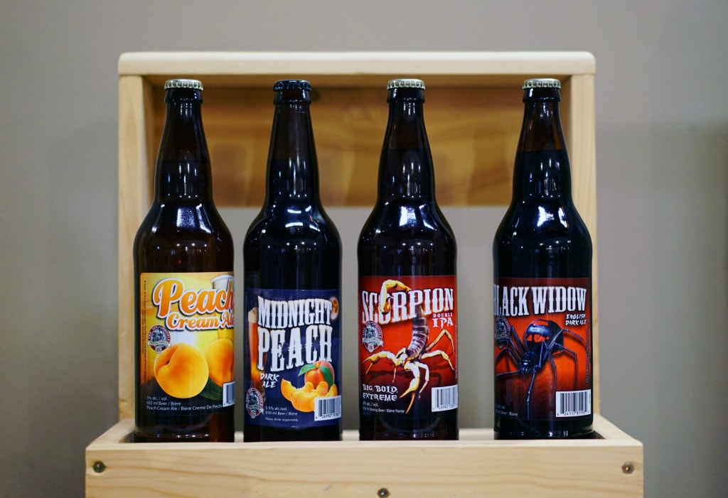 Bombers of craft beer from Tin Whistle Brewing prior to the 2021 rebrand