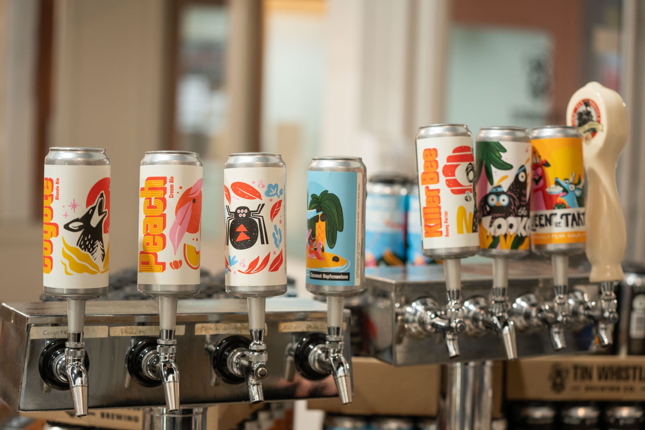 Tap handles, featuring the new illustrations designed in 2021 for Tin Whistle Brewing