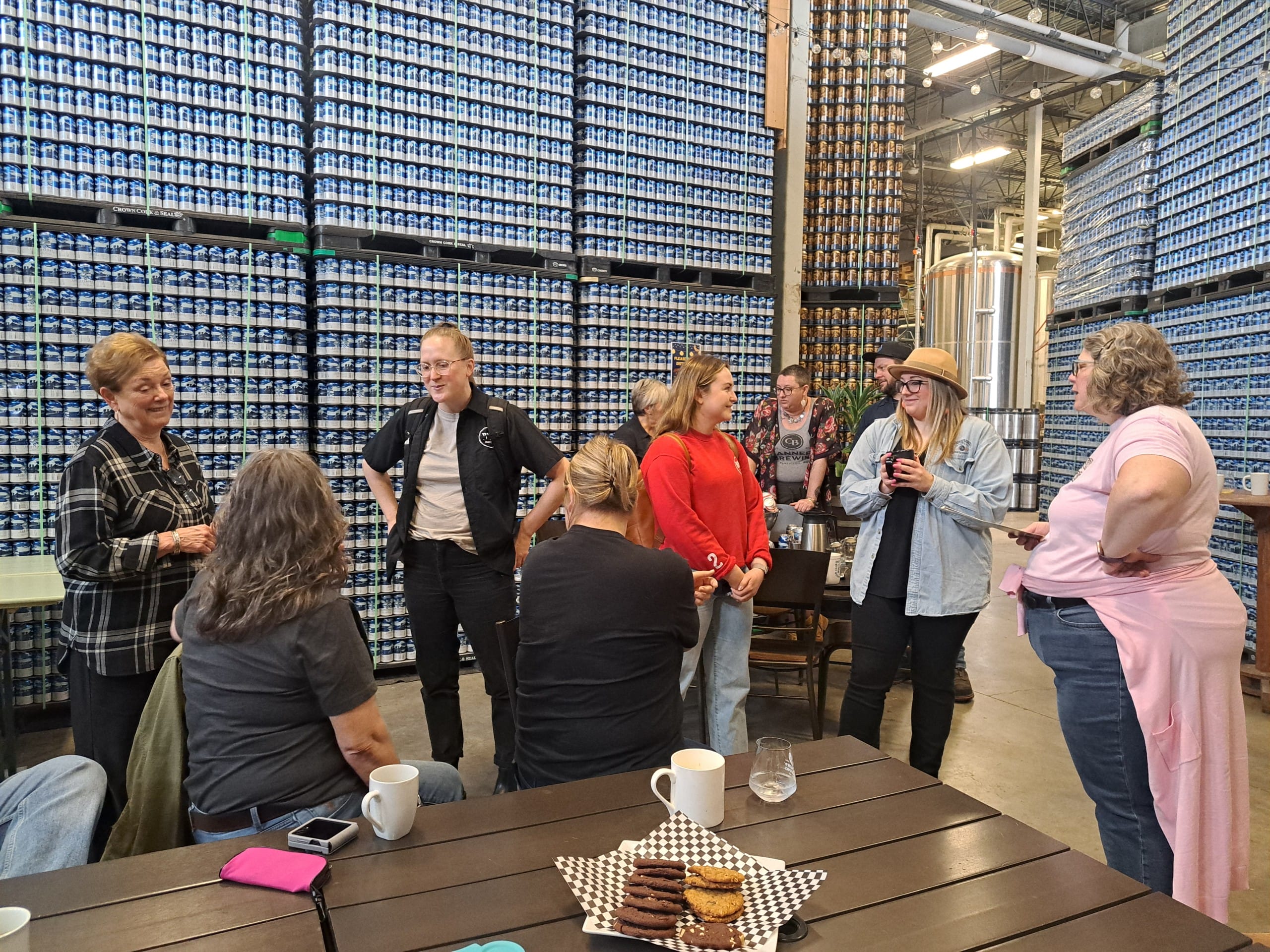 Folks from all around the industry, including competing breweries, network and chat during the Babe Brew collab brew day at Cannery Brewing in Penticton, BC (photo: Hannah Irvine)