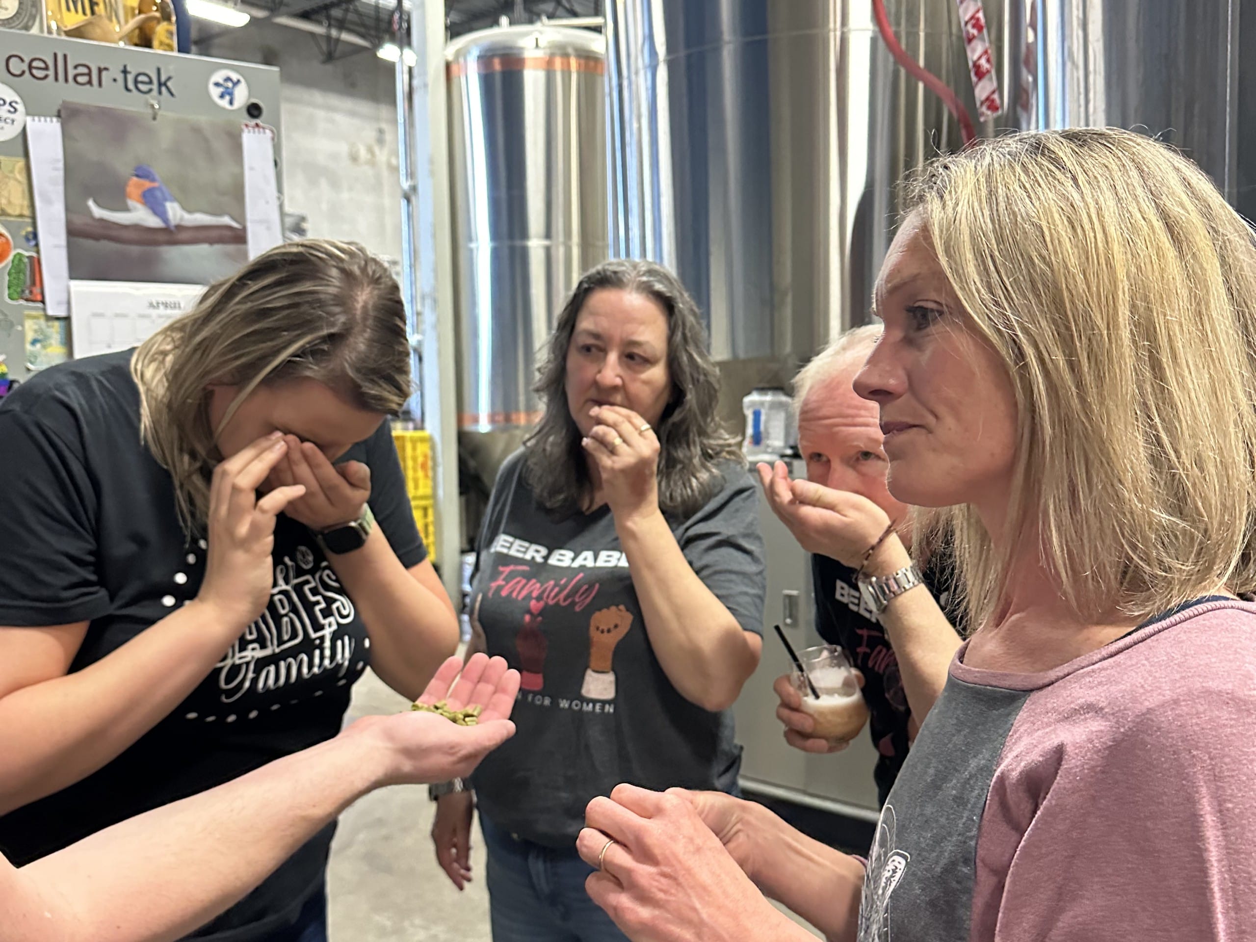 a group of women smell and learn about the hops going into the Brew Babes Milkshake IPA at Cannery Brewing in Penticton, BC