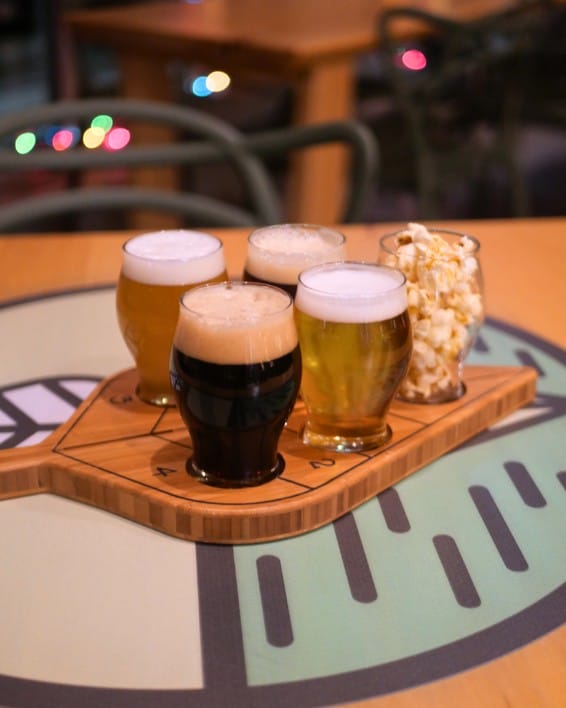 a flight of craft beer and popcorn at Connector Brewing in West Kelowna, BC